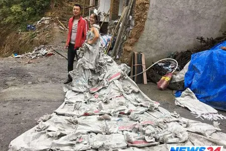 Sement kisələrindən gəlinlik tikdi - VİDEO