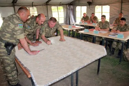 MN: Təlimlərə cəlb edilən qoşunlar tapşırıqları icra edir