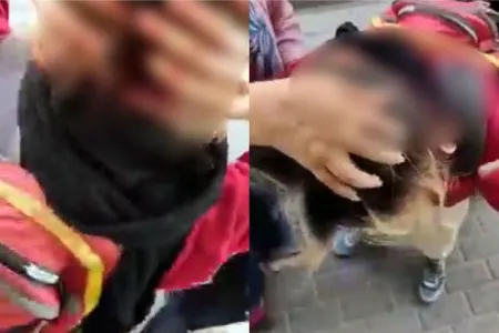 İranda əxlaq polisi etiraz edən qadının başını yardı - VİDEO