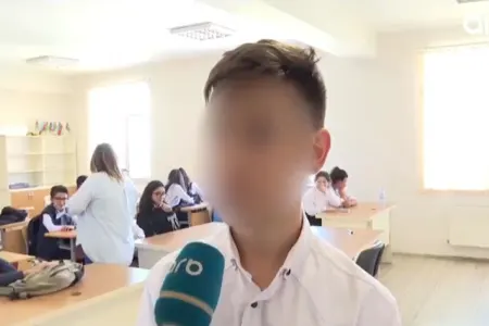 Sinif yoldaşı tərəfindən döyülən şagird DANIŞDI - VİDEO