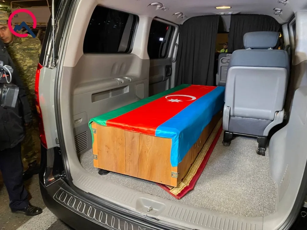 Orxan Əsgərovun nəşinin Bakıda qarşılanma anı - Video