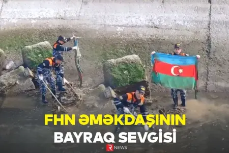 FHN əməkdaşının bayraq sevgisi - Kanaldan tapdı təmizlədi...