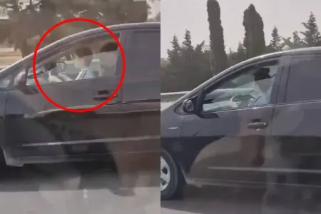 Sürücü "Prius"u qucağında uşaq idarə etdi